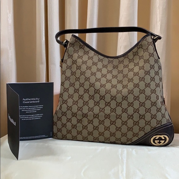 Gucci Handbags - 100% Authentic Gucci Canvas GG New Britt Hobo.